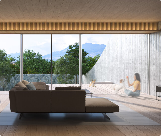 ソファやベッドが設置された、大きな窓から外の自然が見えるモダンな客室