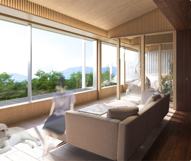 開放的なリビングルームでソファに座ってリラックスする犬と人の様子